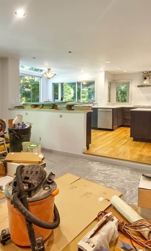 Shelves, circular saw, doors and other remodeling tools and supplies fill the family room as the kitchen is worked on